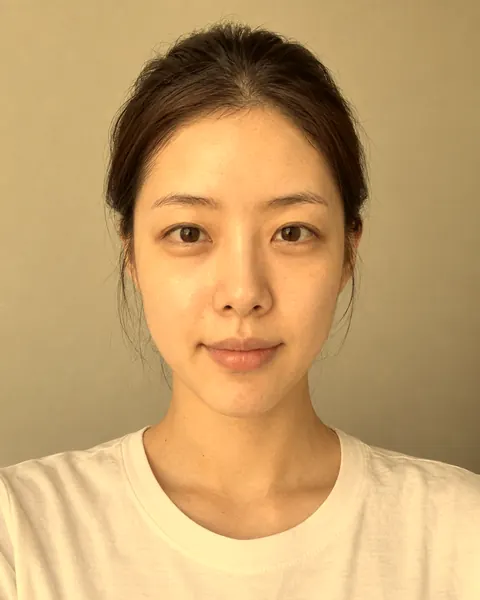 The same selfie tinted yellow by an indoor lamp